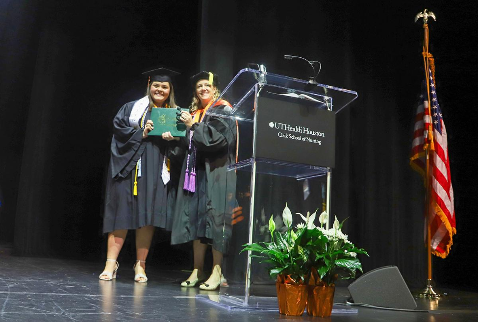 Melanie Raley received the DAISY award from dean Diana Santa Maria